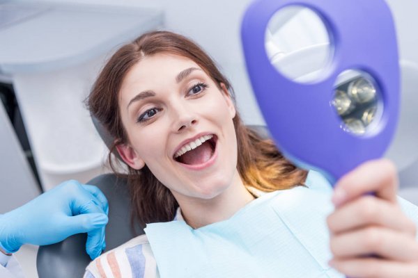 depositphotos_159677836-stock-photo-woman-in-dental-clinic