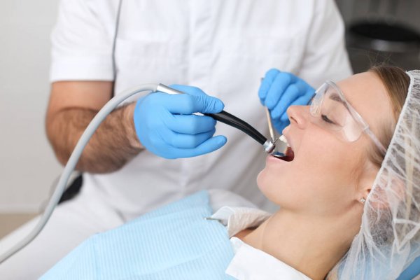 depositphotos_325546882-stock-photo-professional-dentist-drilling-his-patients